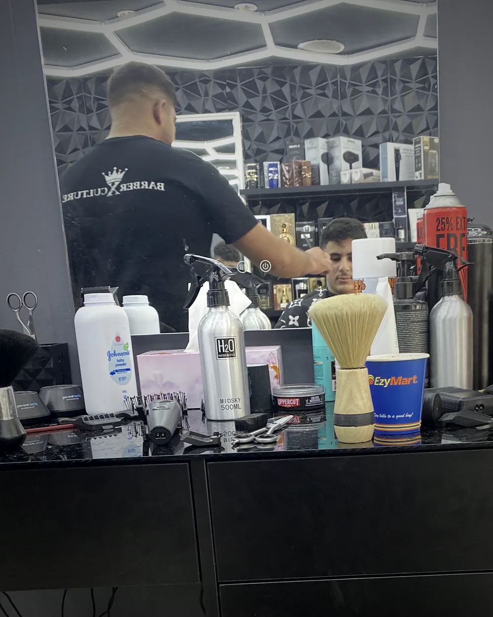 A barber working at his station